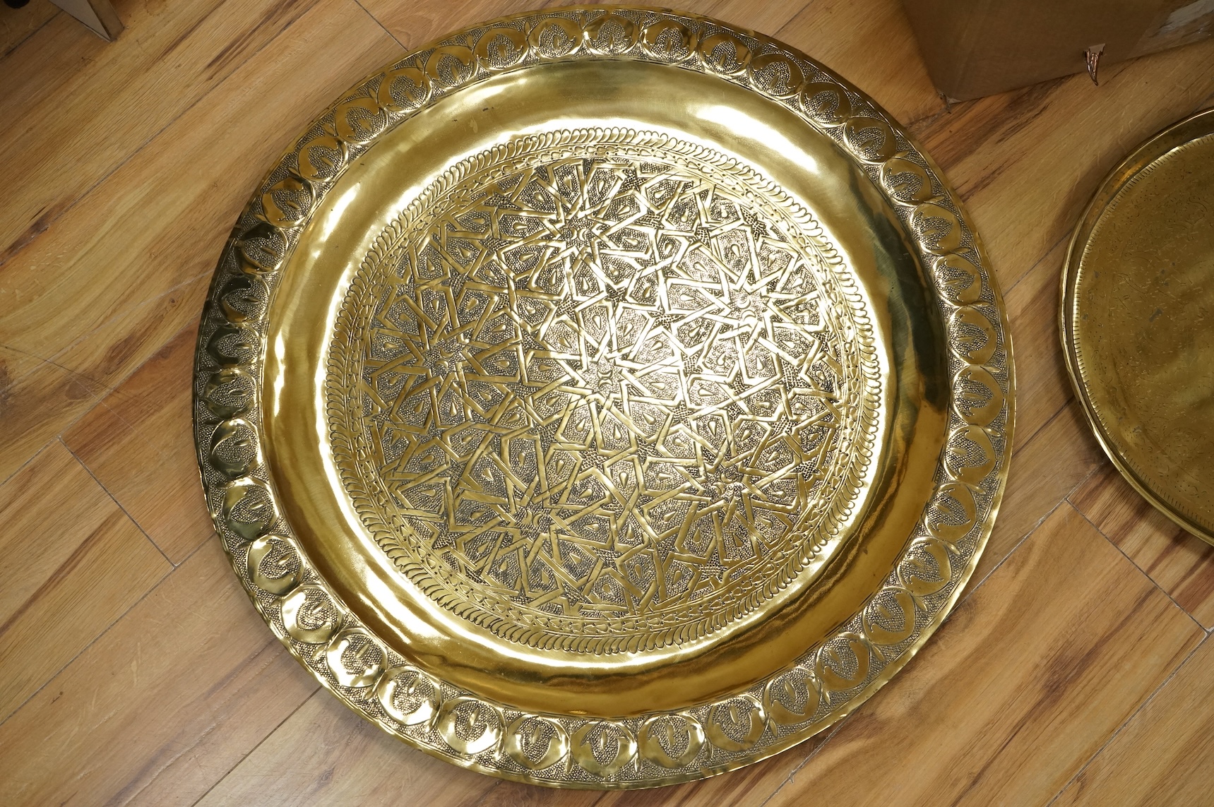 A group of metalware to include brass trays and copper warming pans
